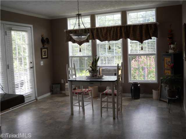 2564 Gideon Grove Road Stokesdale, NC 27357 - Photo 4 of 16 Dining Room. Huge dining area with great view of yard and access to patio