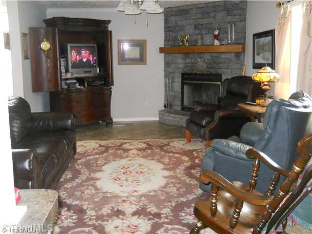 2564 Gideon Grove Road Stokesdale, NC 27357 - Photo 8 of 16 Den/Family/Great Room. Cozy den with fireplace