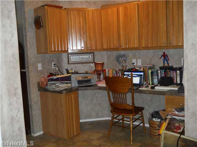 2564 Gideon Grove Road Stokesdale, NC 27357 - Photo 9 of 16 Computer Room. Desk and cabinetry located just off the kitchen