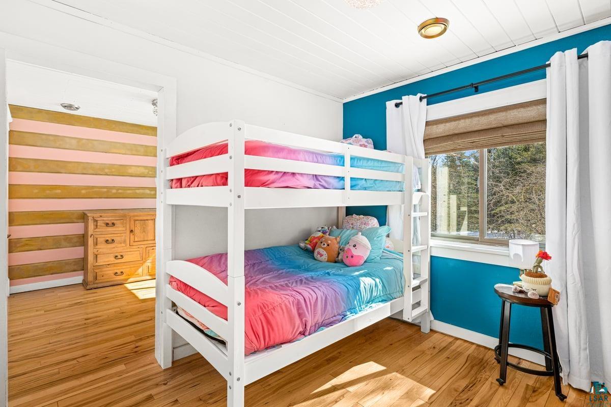 27 West Stark Road Esko, MN 55733 - Photo 27 of 47 Bedroom with light wood-style flooring, wooden ceiling, and crown molding