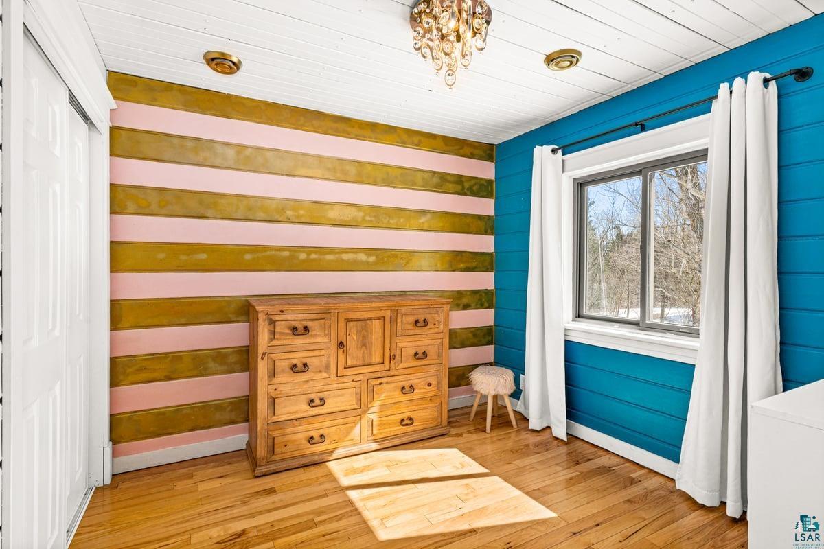 27 West Stark Road Esko, MN 55733 - Photo 28 of 47 Bedroom with light wood finished floors and a closet