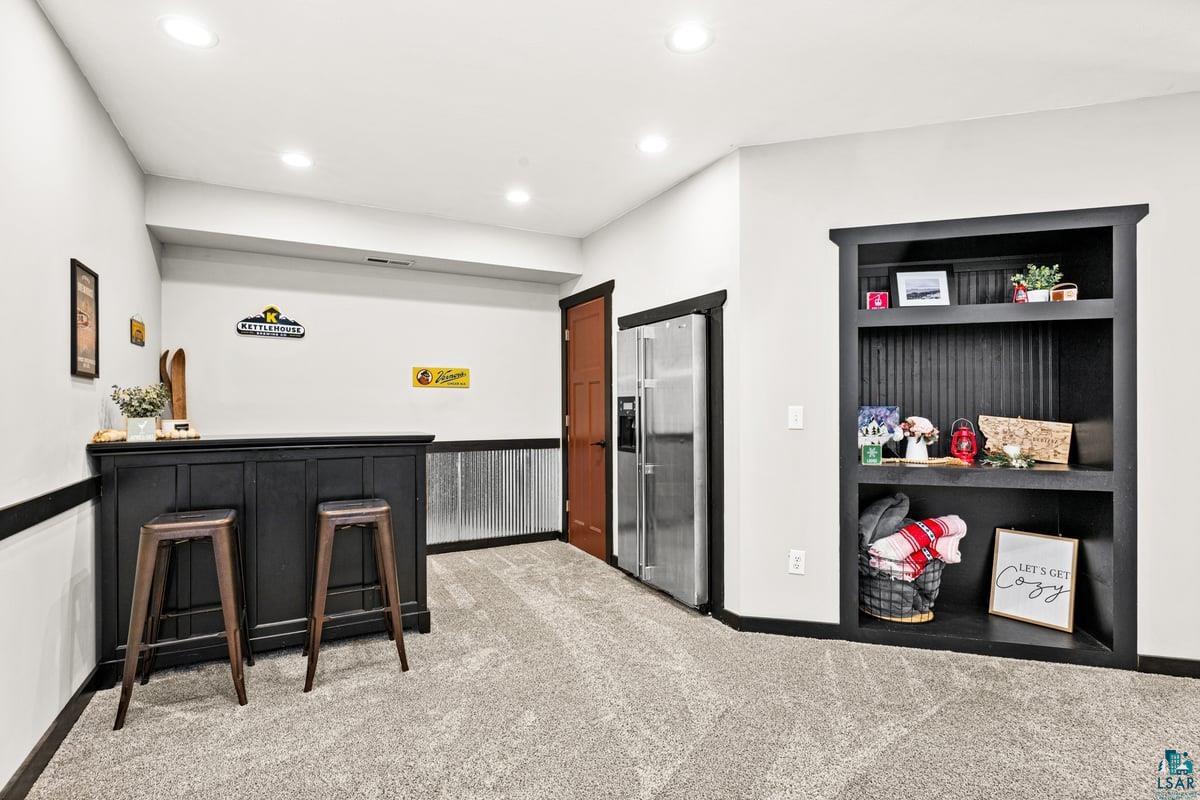 27 West Stark Road Esko, MN 55733 - Photo 35 of 47 Interior space featuring light carpet and recessed lighting