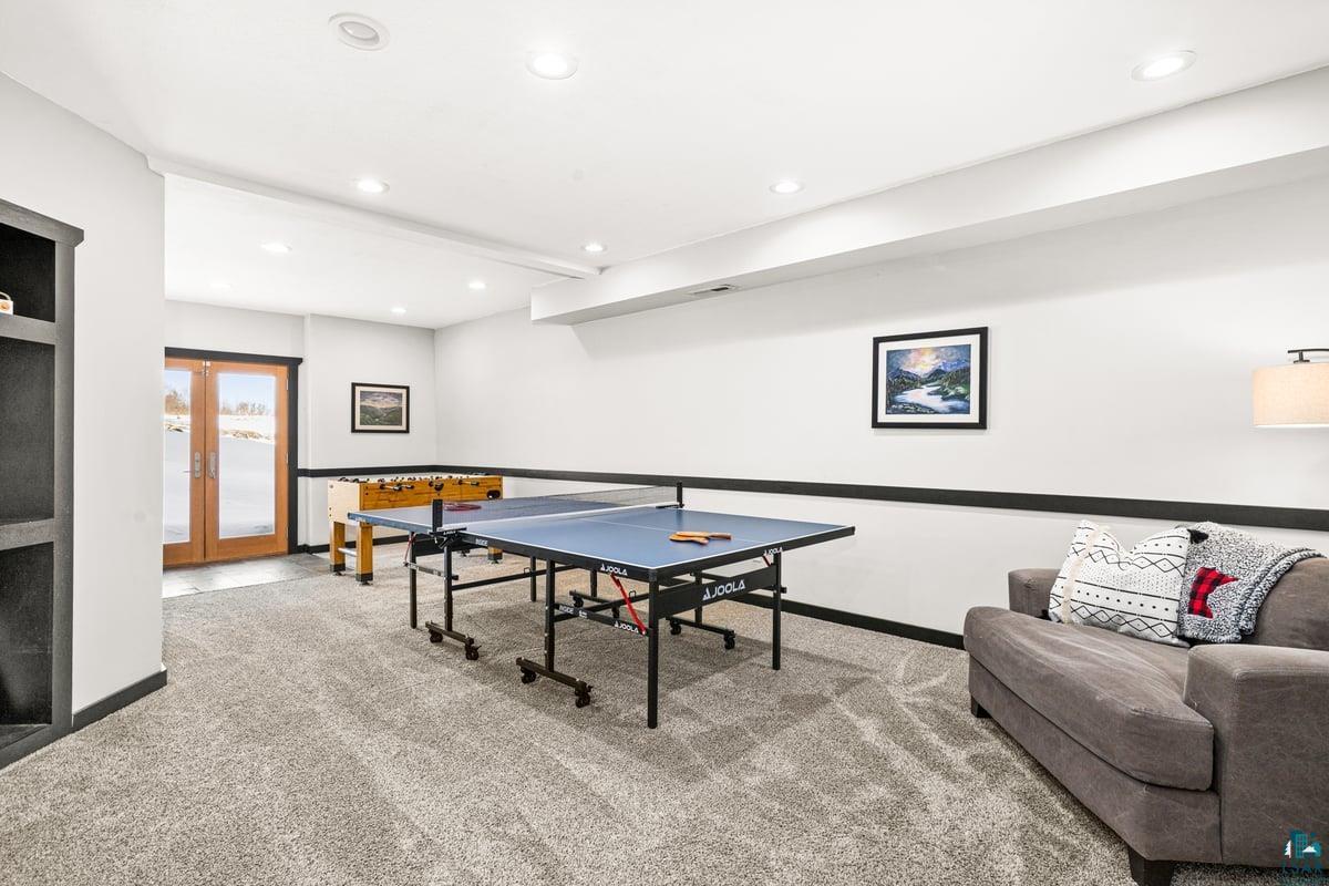 27 West Stark Road Esko, MN 55733 - Photo 36 of 47 Playroom with light carpet, recessed lighting, and french doors