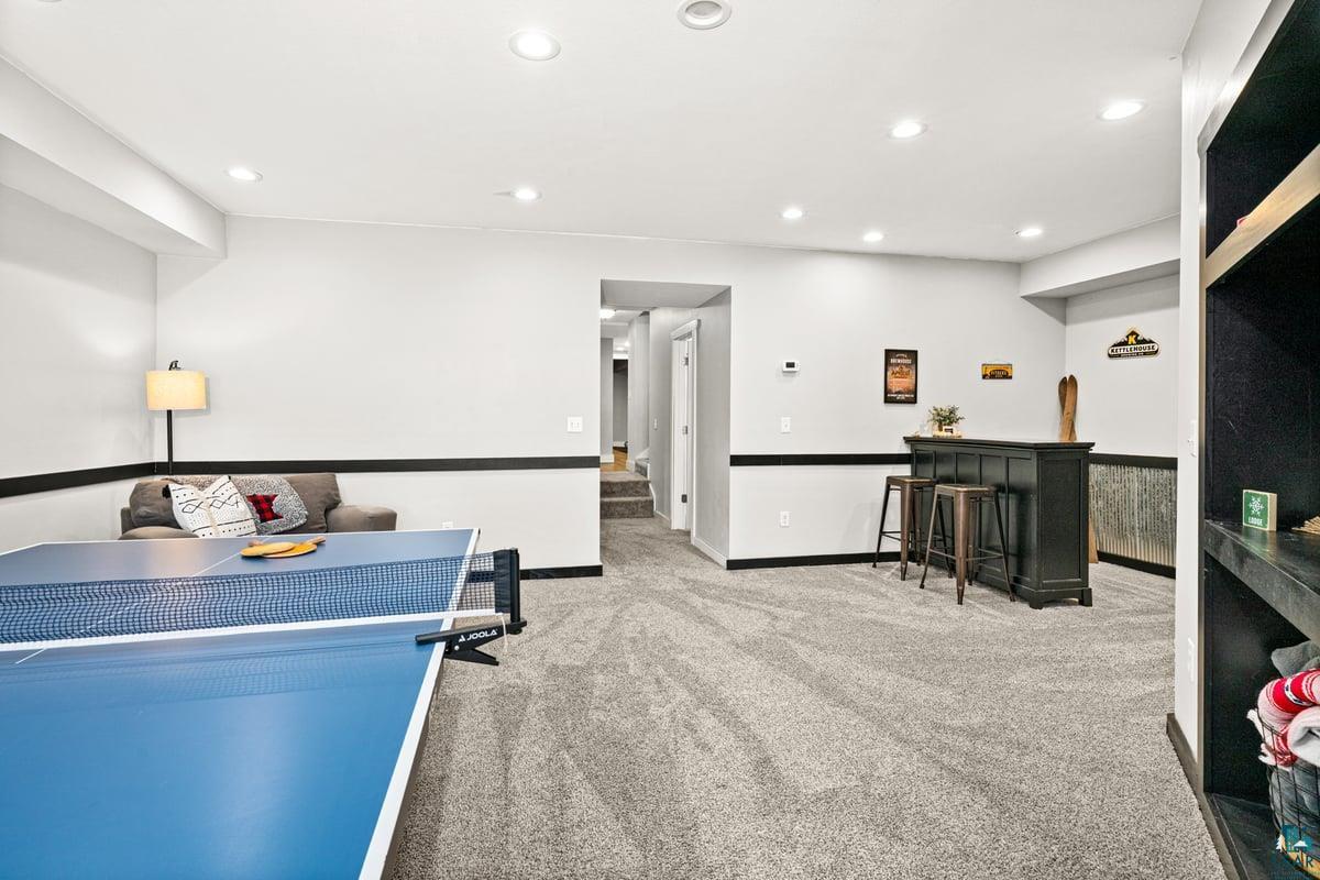 27 West Stark Road Esko, MN 55733 - Photo 37 of 47 Game room with light carpet and recessed lighting