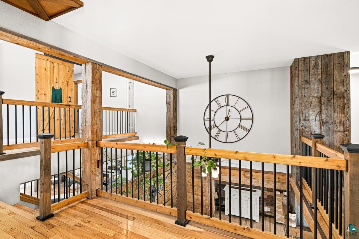 27 West Stark Road Esko, MN 55733 - Photo 40 of 47 Hall featuring an upstairs landing and hardwood / wood-style floors