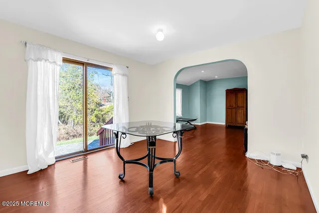 a kitchen with stainless steel appliances granite countertop a refrigerator a stove and a sink