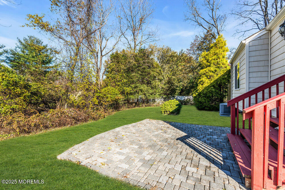 345 Green Grove Road Tinton Falls, NJ 07712 - Photo 12 of 80 a view of a backyard with a garden