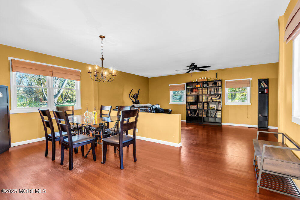 345 Green Grove Road Tinton Falls, NJ 07712 - Photo 20 of 80 a view of a dining room with furniture and wooden floor