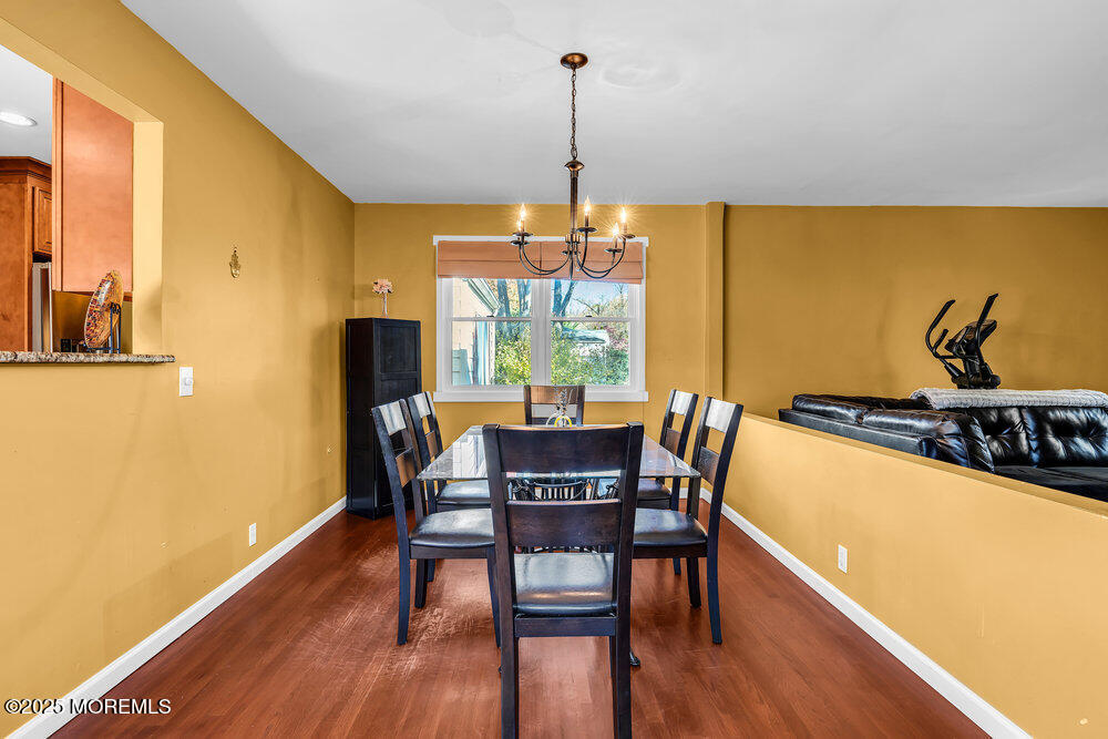 345 Green Grove Road Tinton Falls, NJ 07712 - Photo 21 of 80 a view of a dining room with furniture window and wooden floor