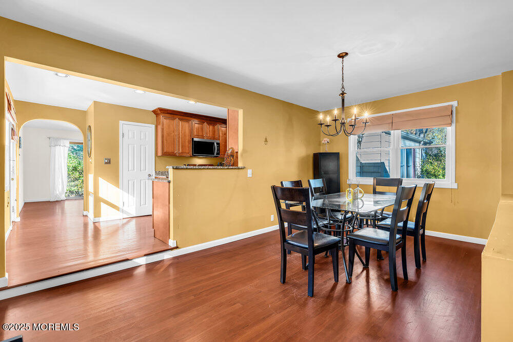 345 Green Grove Road Tinton Falls, NJ 07712 - Photo 22 of 80 a view of a dining room with furniture window and wooden floor
