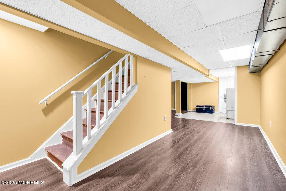 345 Green Grove Road Tinton Falls, NJ 07712 - Photo 34 of 80 a view of entryway and hall with wooden floor