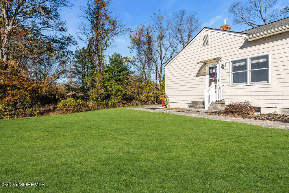 345 Green Grove Road Tinton Falls, NJ 07712 - Photo 40 of 80 a backyard of a house with lots of green space