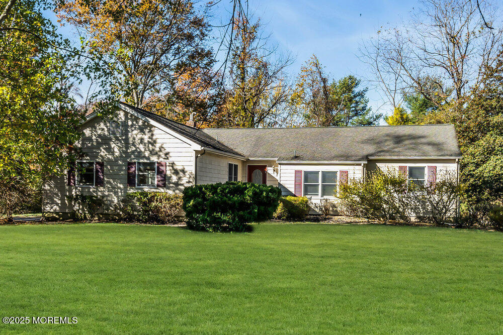 345 Green Grove Road Tinton Falls, NJ 07712 - Photo 42 of 80 a front view of house with yard and green space