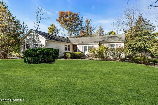 a view of a house with a big yard