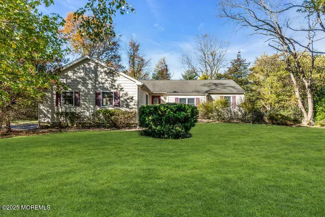 an aerial view of residential building with green space