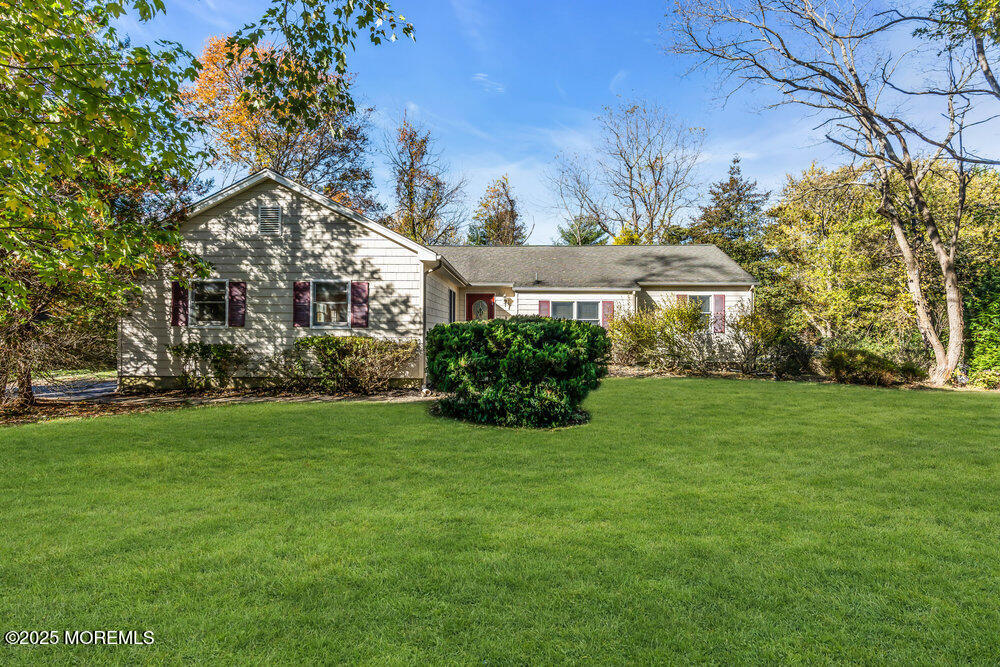 345 Green Grove Road Tinton Falls, NJ 07712 - Photo 44 of 80 a front view of a house with garden