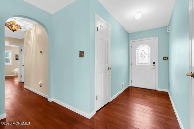 a view of livingroom with hardwood floor and a sink