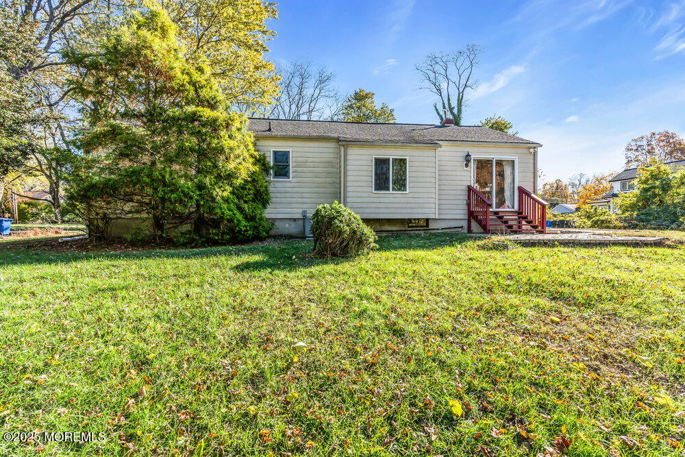 345 Green Grove Road Tinton Falls, NJ 07712 - Photo 55 of 80 a view of a house with a yard and sitting area