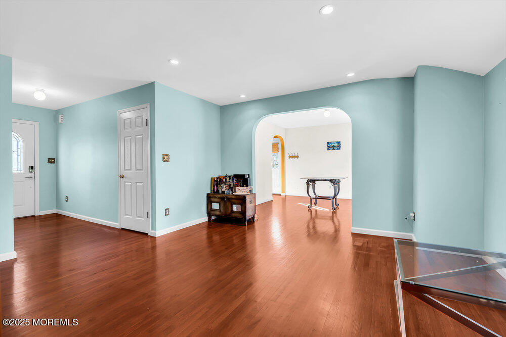 345 Green Grove Road Tinton Falls, NJ 07712 - Photo 6 of 80 a view of livingroom with hardwood floor and a sink