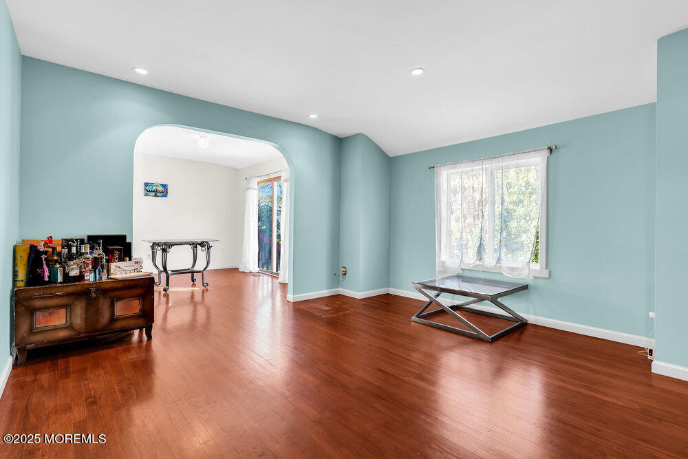 345 Green Grove Road Tinton Falls, NJ 07712 - Photo 8 of 80 a view of a room with wooden floor and furniture