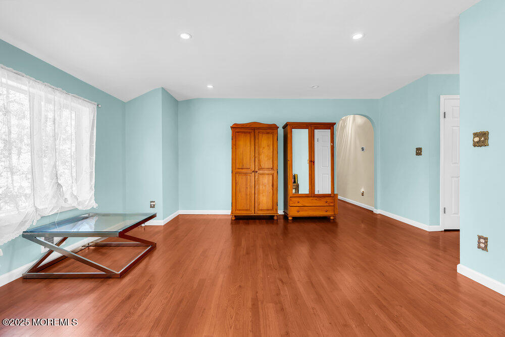 345 Green Grove Road Tinton Falls, NJ 07712 - Photo 9 of 80 a view of room with window and wooden floor