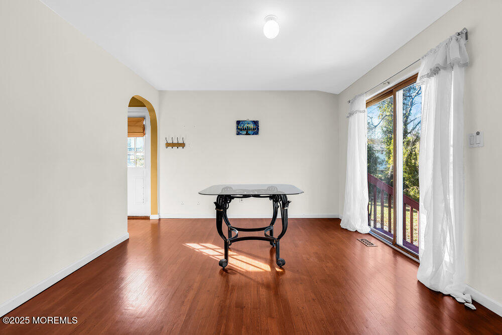345 Green Grove Road Tinton Falls, NJ 07712 - Photo 10 of 80 a view of a room with wooden floor lounge chair and windows