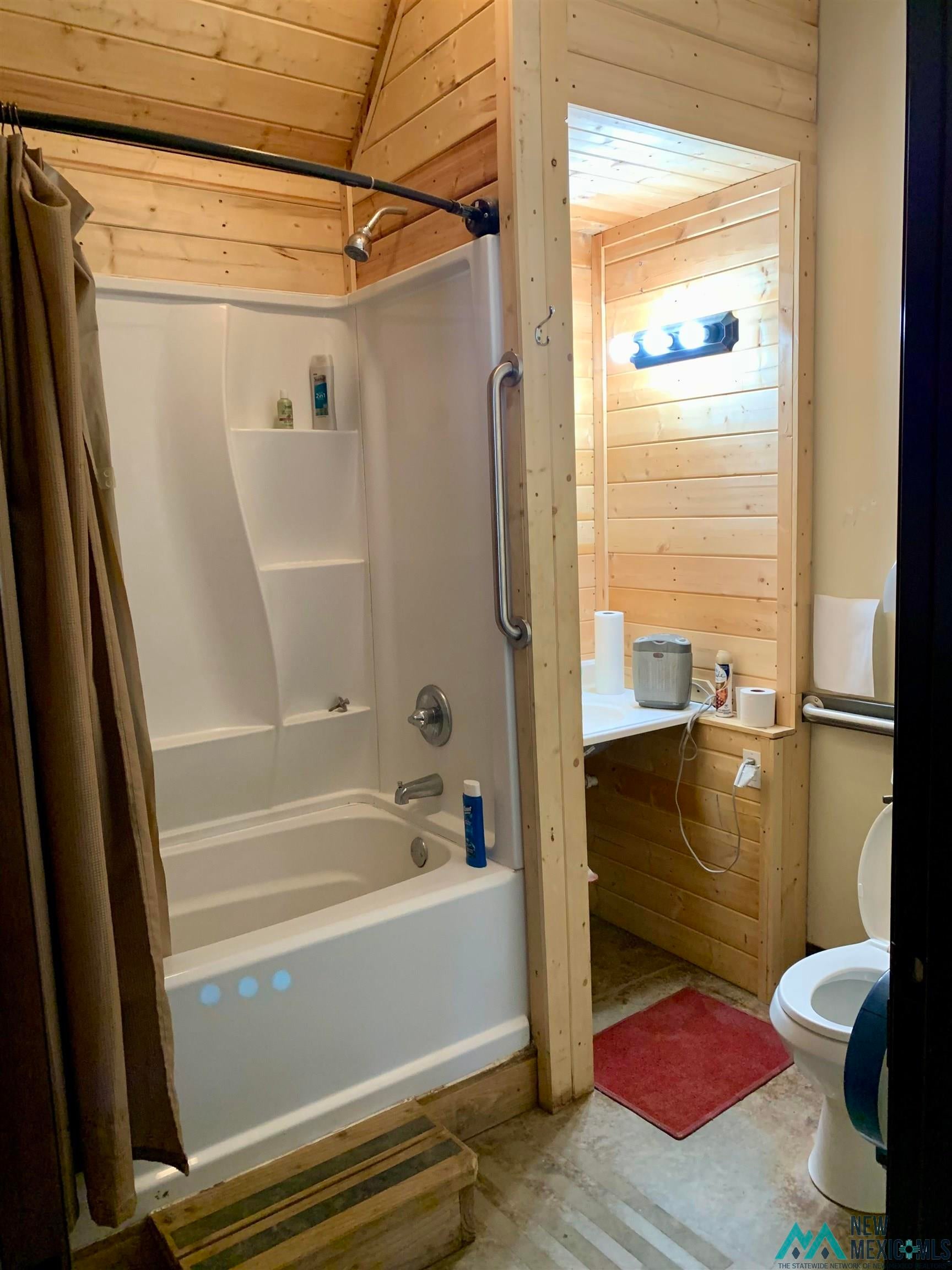 371 Candy Kitchen Road Candy Kitchen, NM 87357 - Photo 7 of 49 Bathroom featuring wood-paneled walls and a vaulted wood-paneled ceiling