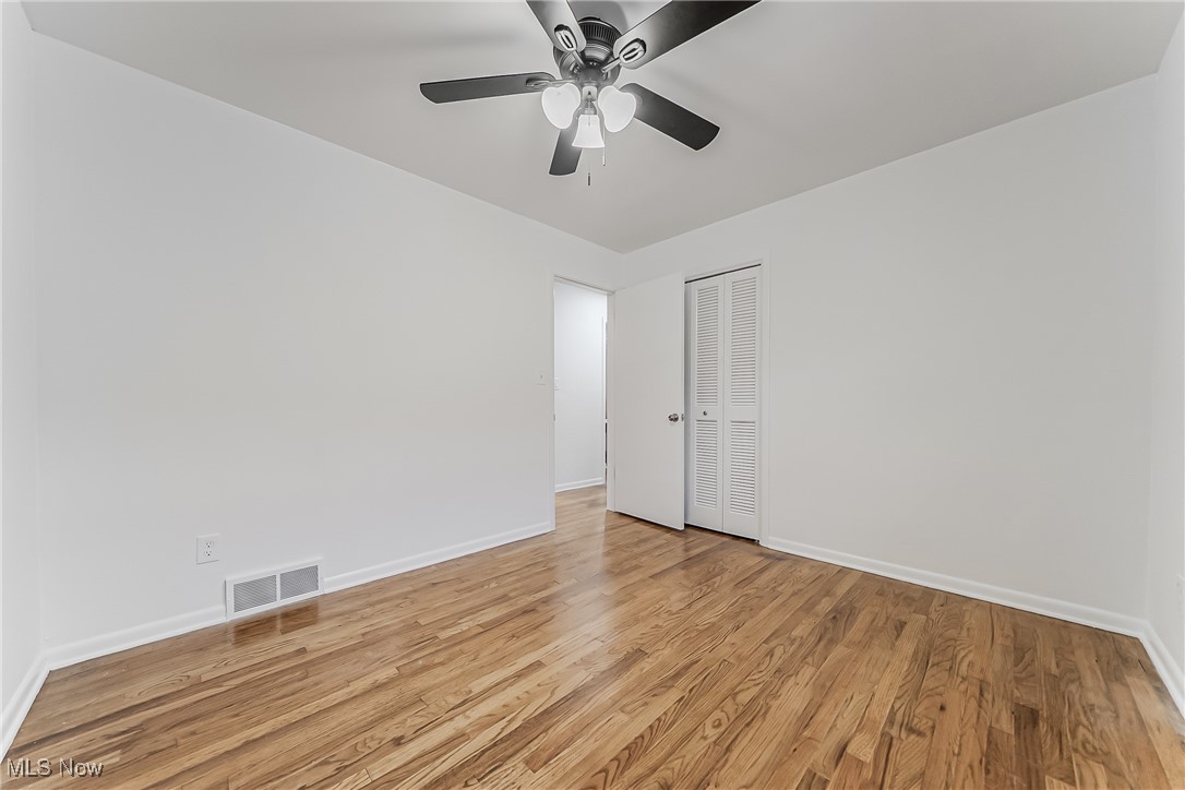 1122 Homestead Road Cleveland, OH 44121 - Photo 14 of 27 Bedroom with a ceiling fan and light hardwood floors