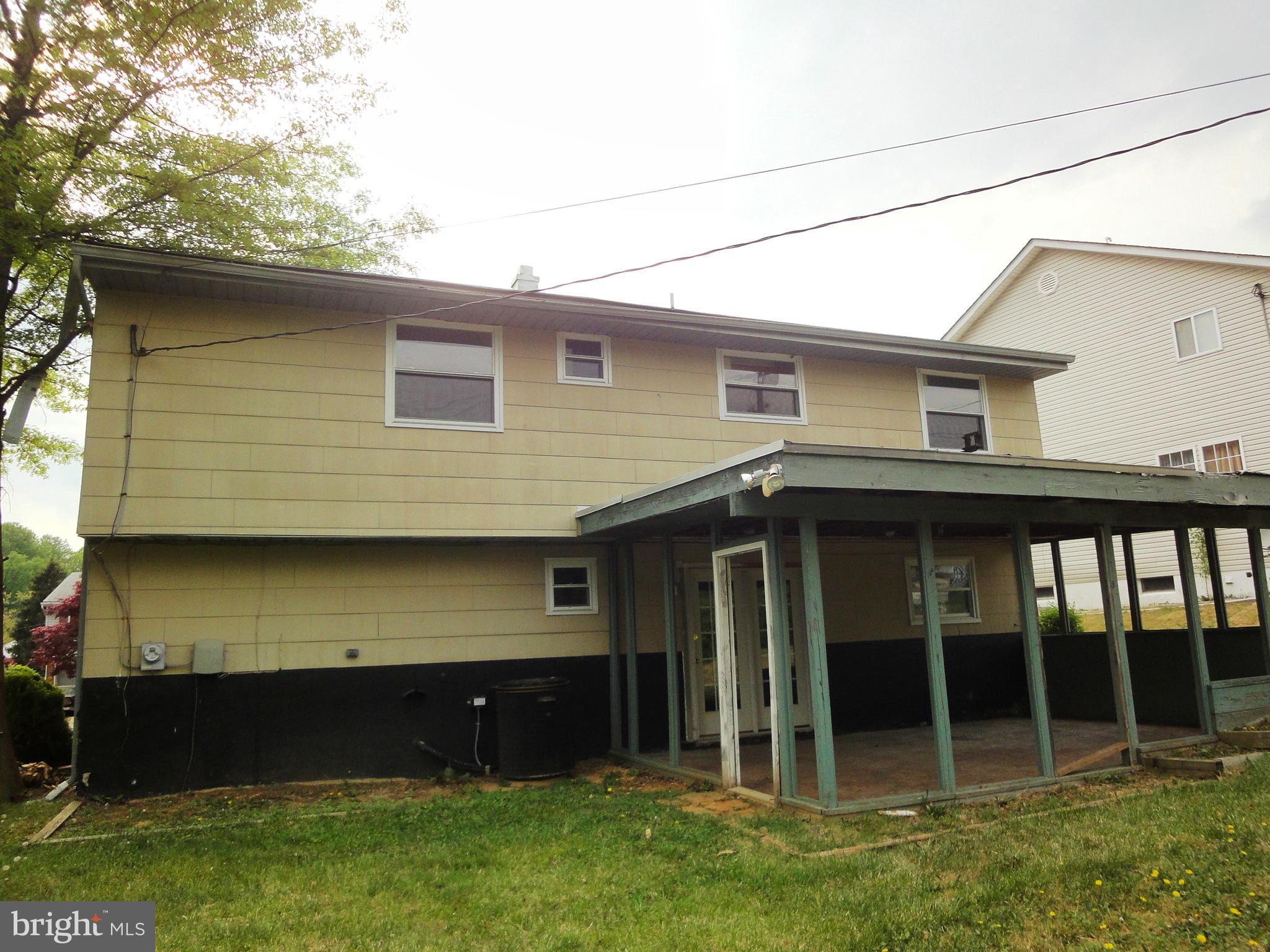 3905 Zurich Road Randallstown, MD 21133 - Photo 12 of 13 a front view of a house with a garden