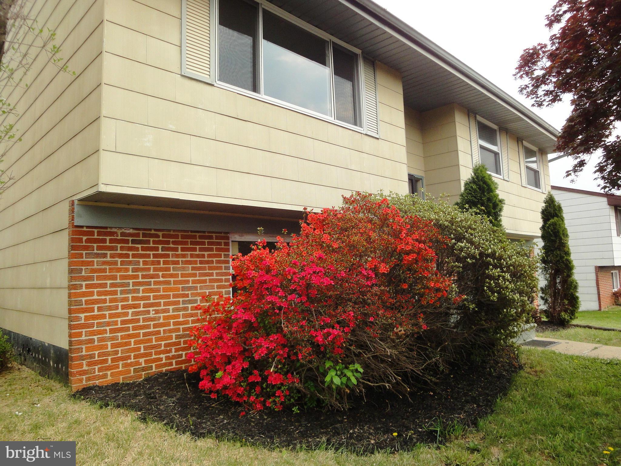 3905 Zurich Road Randallstown, MD 21133 - Photo 13 of 13 a front view of a house with a yard and garage