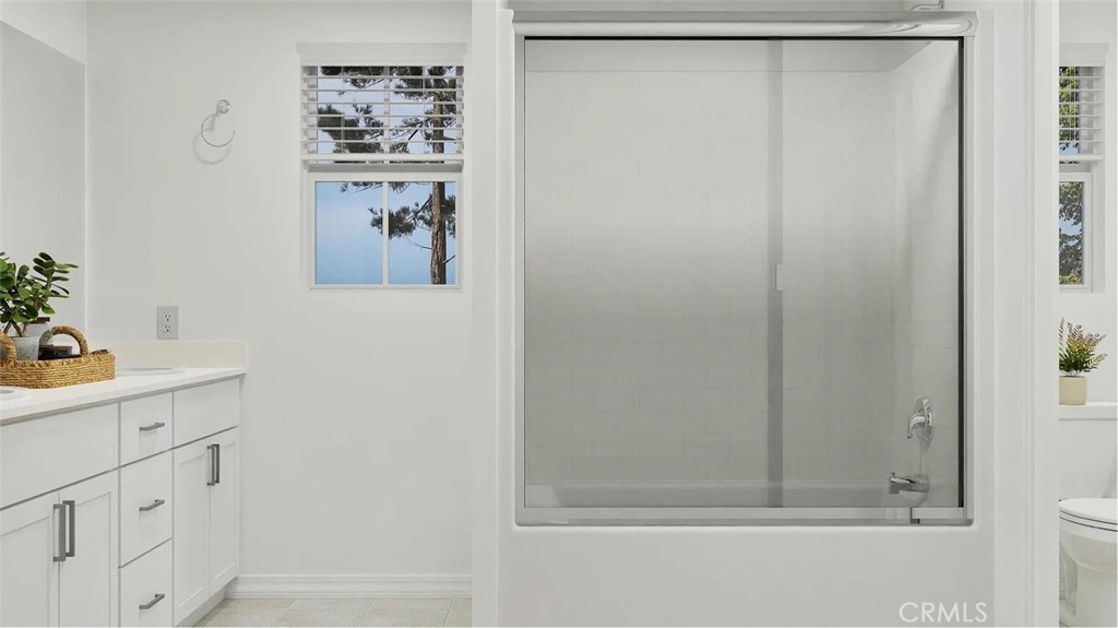 1207 Yeager Avenue Rialto, CA 92376 - Photo 13 of 17 a bathroom with a shower and a sink