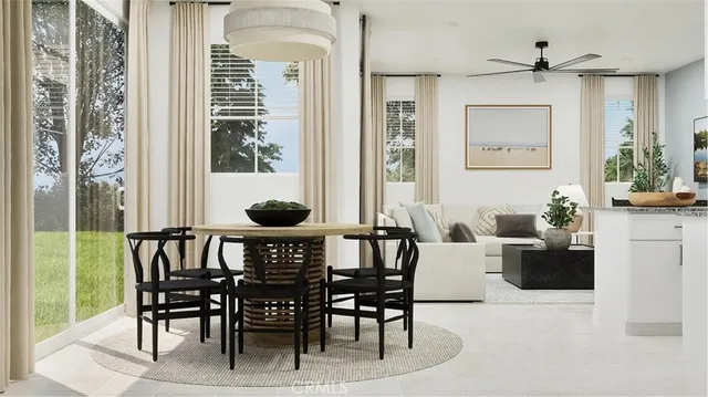 a view of a dining room with furniture and window