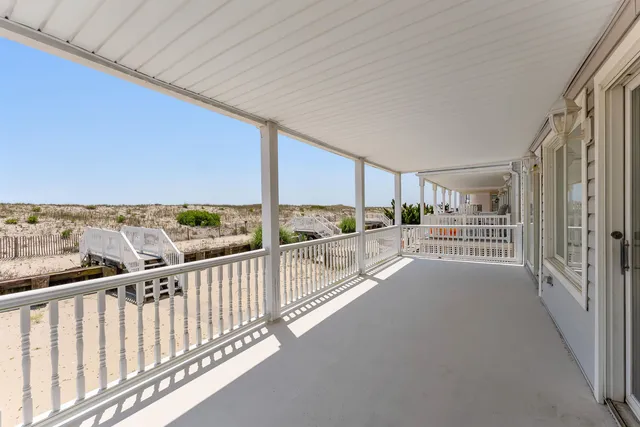 a large kitchen with kitchen island a sink stainless steel appliances and cabinets