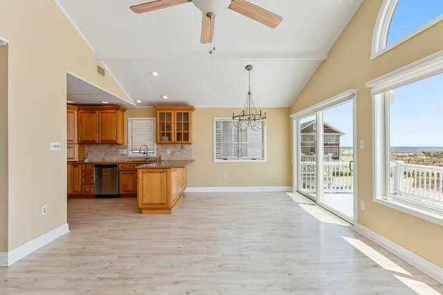 a kitchen with a sink a stove and cabinets