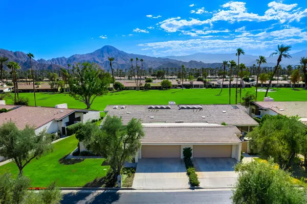 an aerial view of a house with a garden