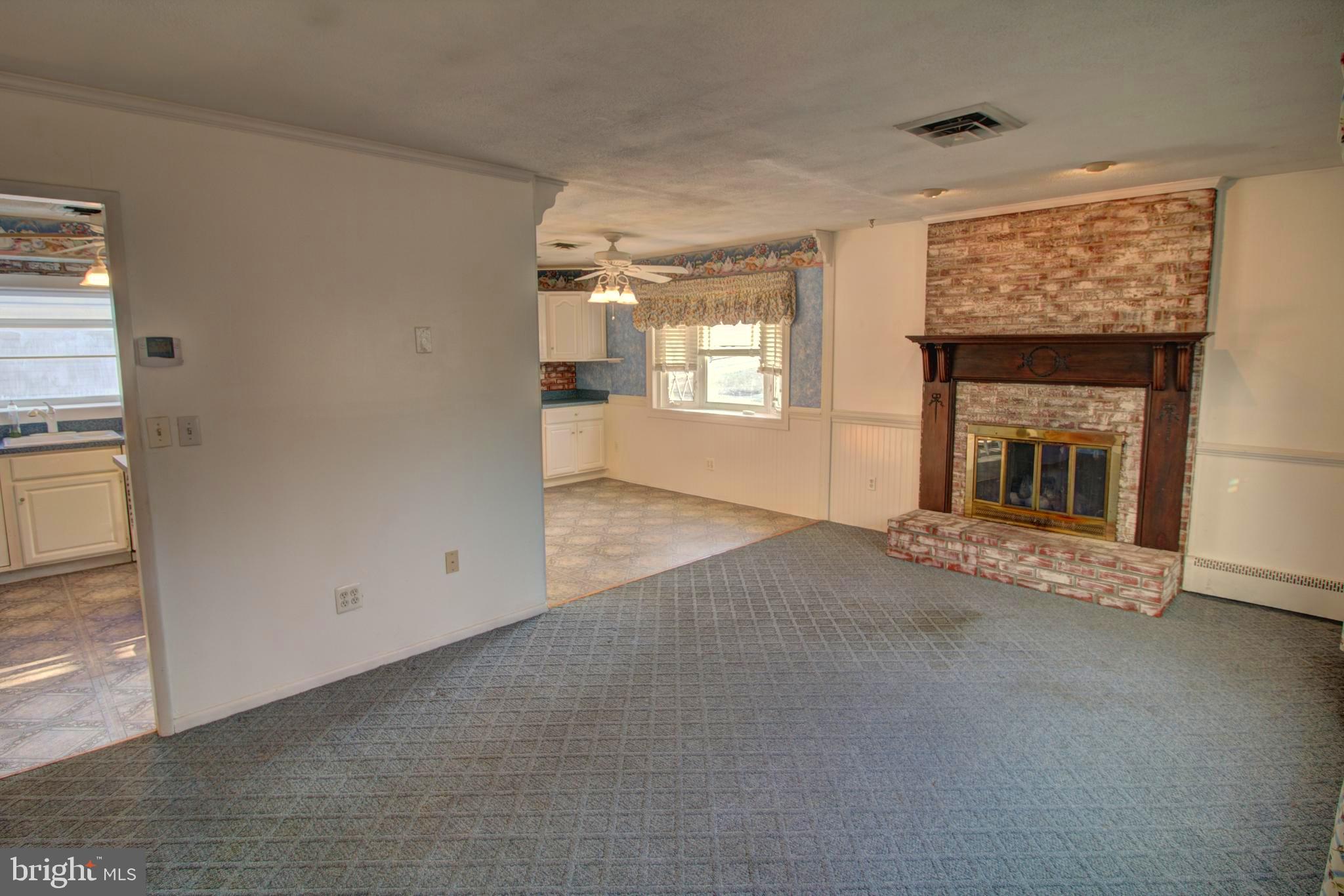 5805 Oakland Road Baltimore, MD 21227 - Photo 16 of 36 living room with gas fireplace