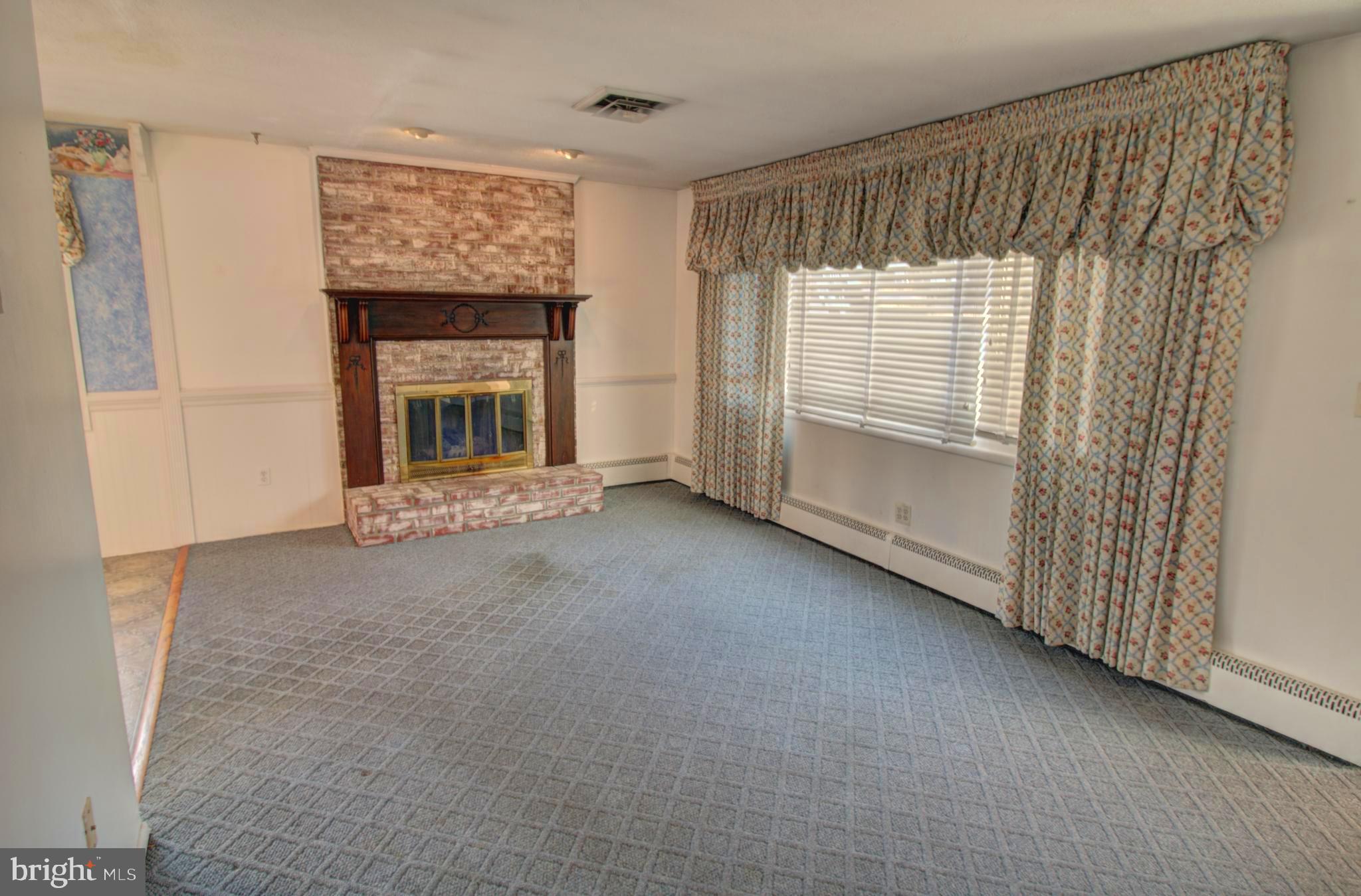5805 Oakland Road Baltimore, MD 21227 - Photo 17 of 36 living room with gas fireplace