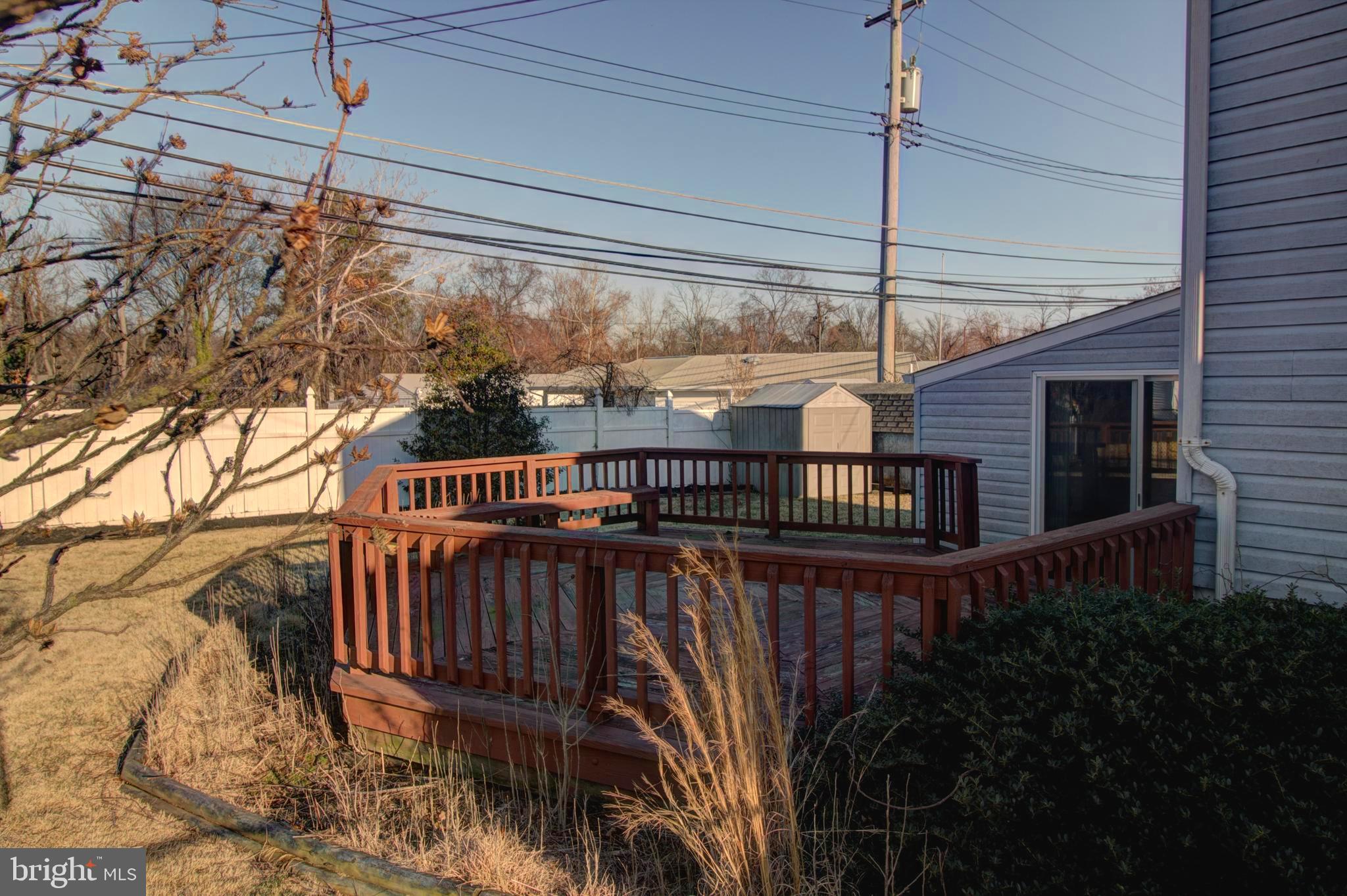 5805 Oakland Road Baltimore, MD 21227 - Photo 9 of 36 rear deck evening shade
