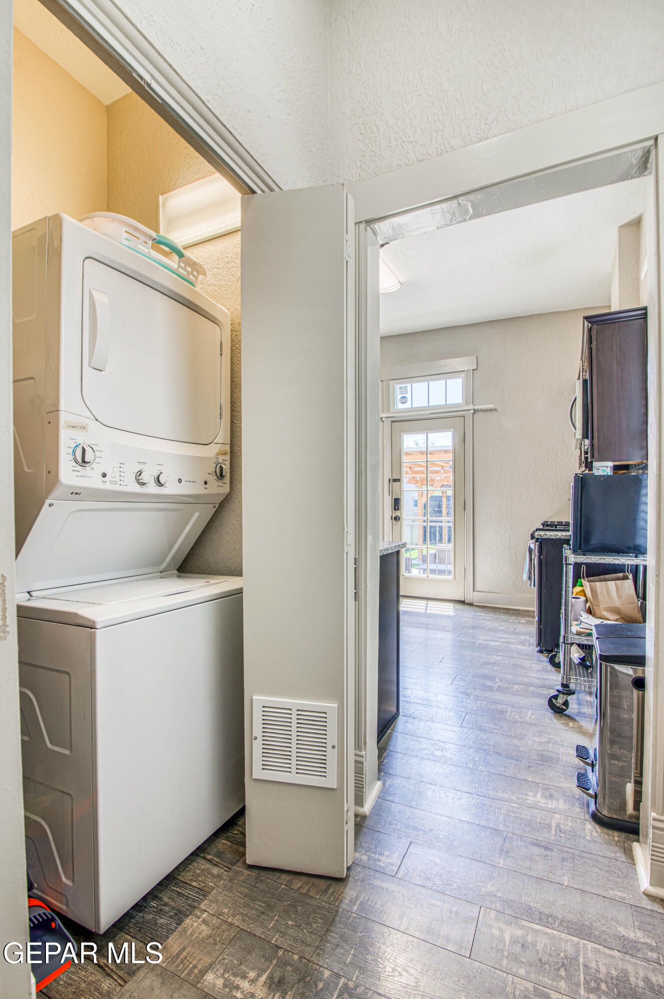 640 Stewart Court El Paso, TX 79902 - Photo 18 of 31 a view of hallway with washer and dryer