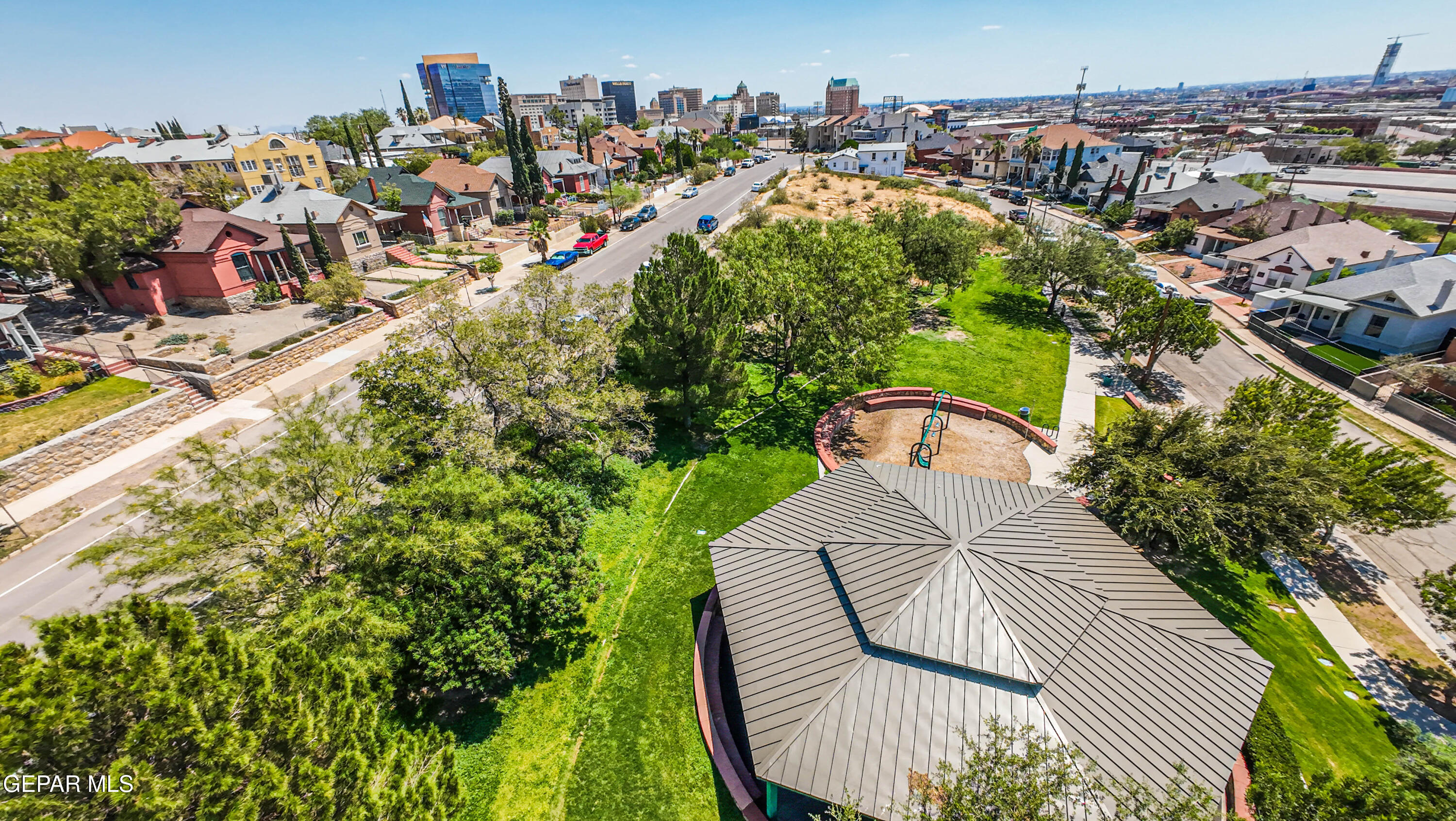 640 Stewart Court El Paso, TX 79902 - Photo 28 of 31 an aerial view of a house with a garden and trees