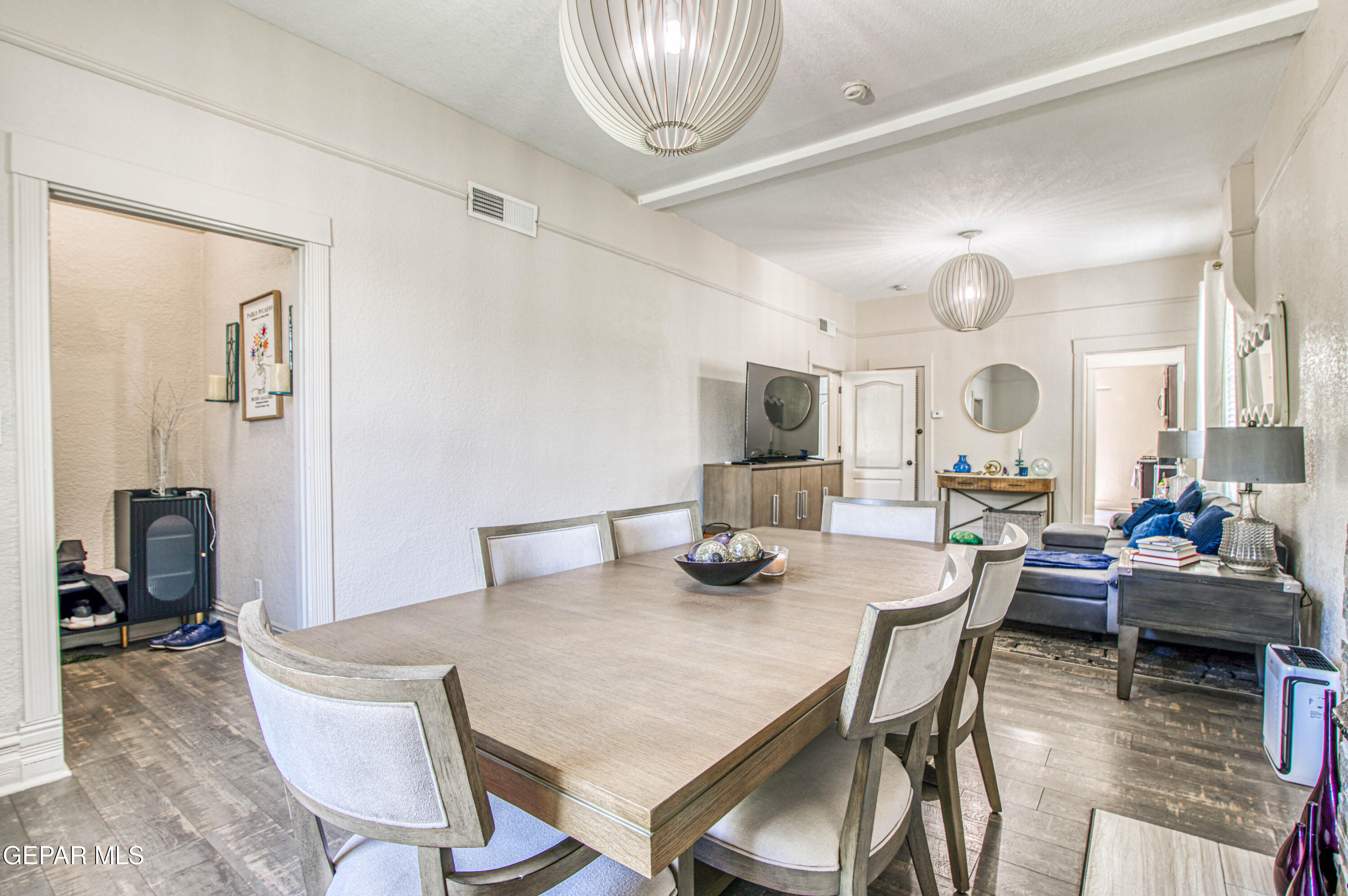 640 Stewart Court El Paso, TX 79902 - Photo 7 of 31 a view of a dining room with furniture and a chandelier