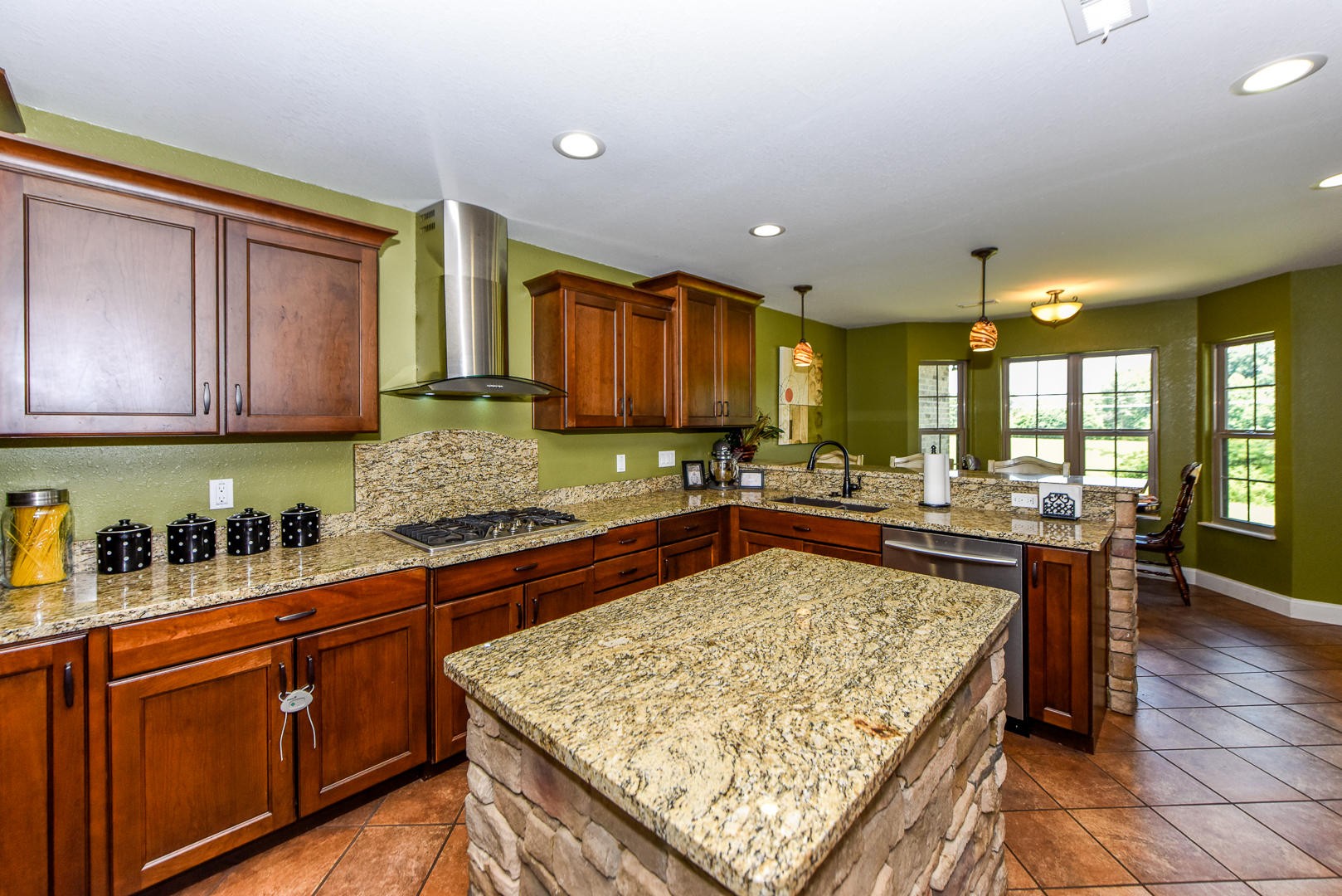 3150 Sam James Road Maryville, TN 37803 - Photo 13 of 35 a kitchen with stainless steel appliances granite countertop wooden cabinets a stove and a sink