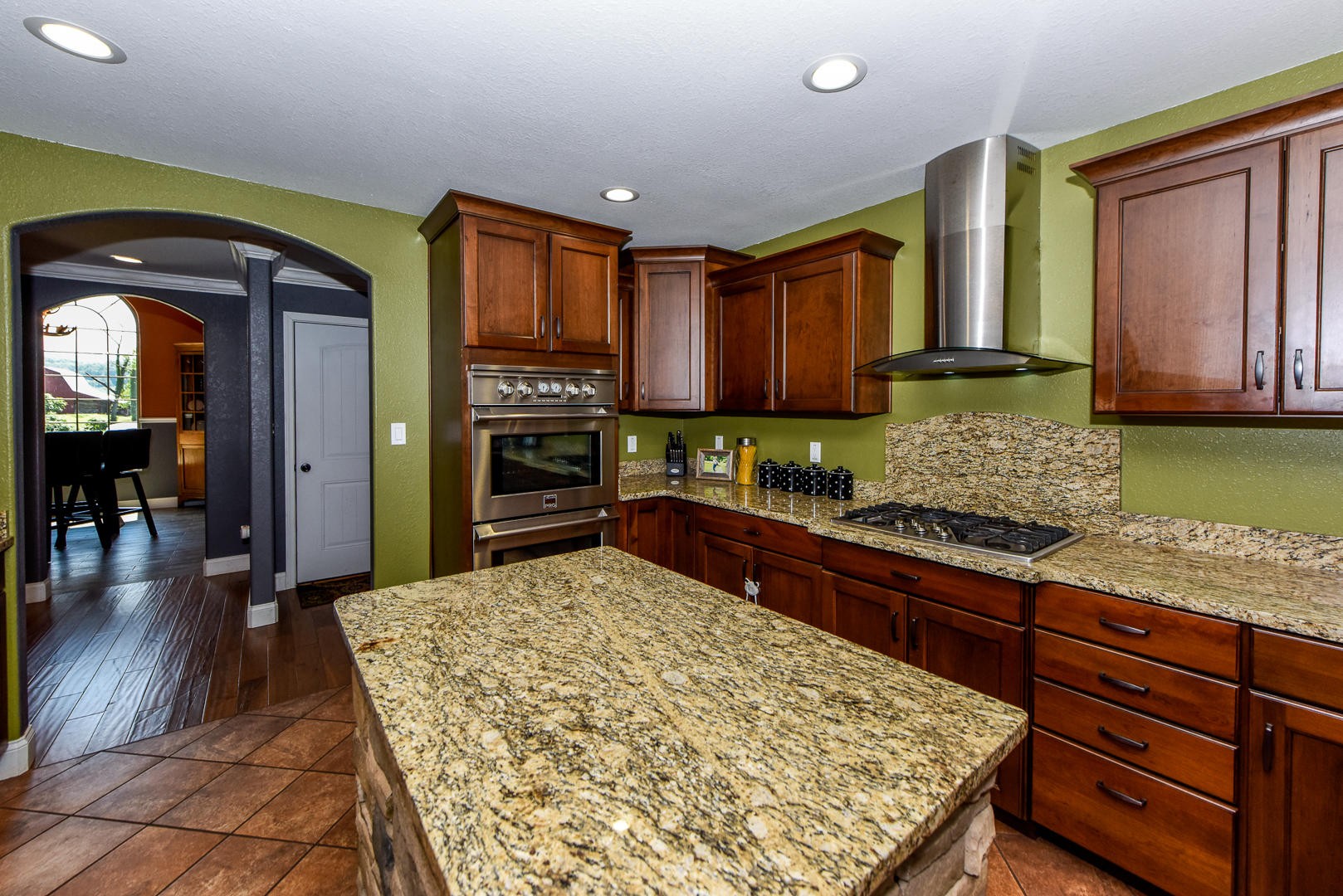 3150 Sam James Road Maryville, TN 37803 - Photo 15 of 35 a kitchen with stainless steel appliances granite countertop wooden cabinets a stove and a sink