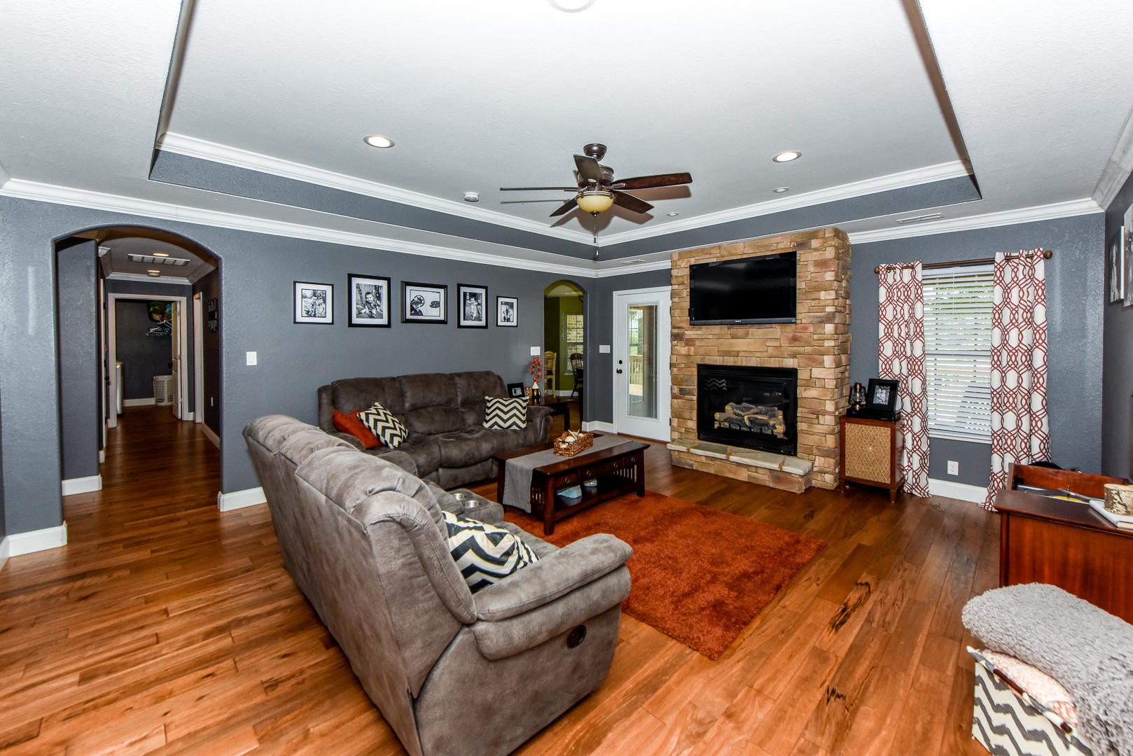 3150 Sam James Road Maryville, TN 37803 - Photo 8 of 35 a living room with furniture flat screen tv and a fireplace