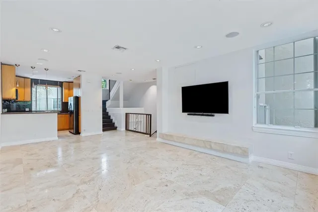 a room with furniture and a flat screen tv