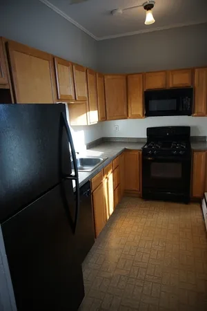a kitchen with a stove and a microwave