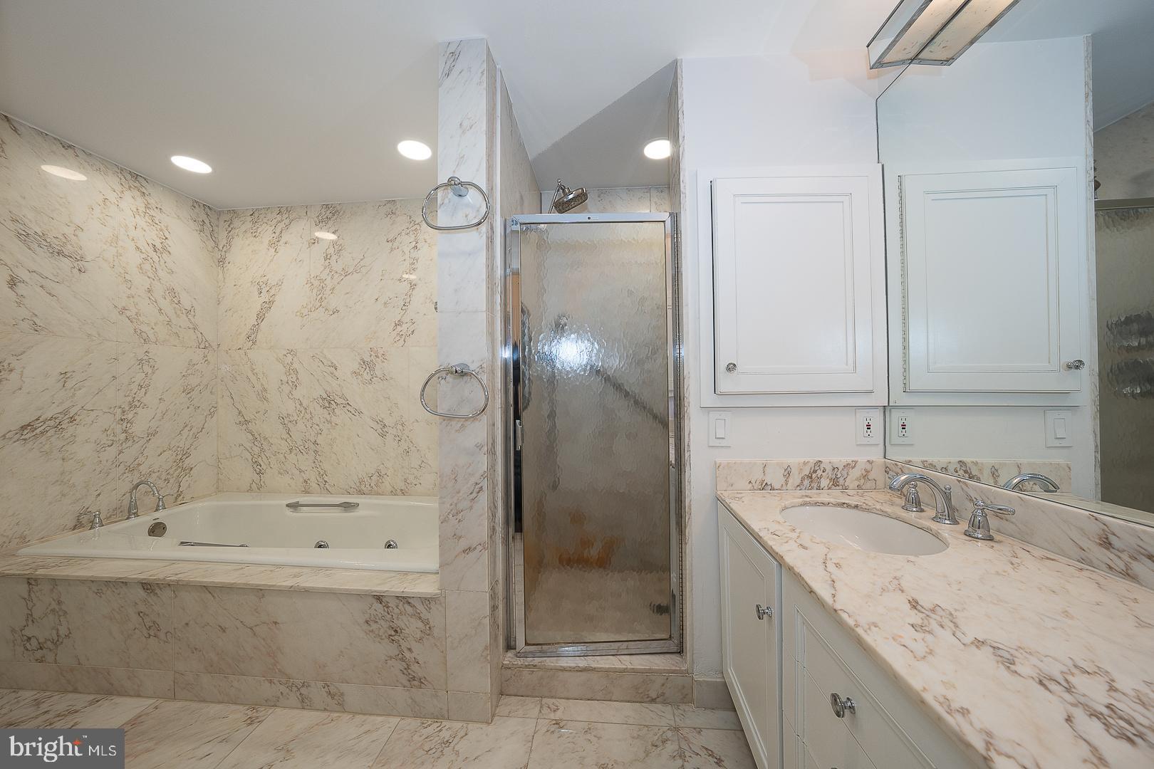 39-41 Fairview Road Penn Valley, PA 19072 - Photo 12 of 37 a bathroom with a granite countertop sink a shower and a mirror