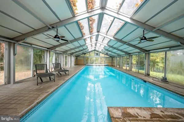 a view of a swimming pool with a patio