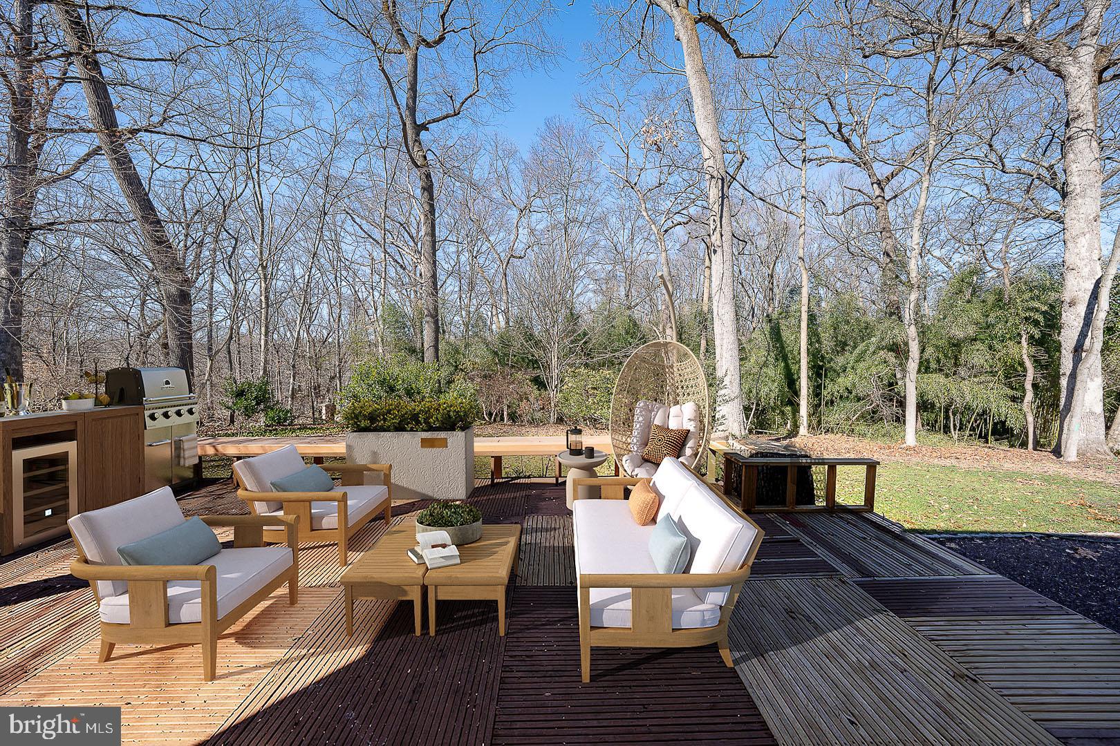 39-41 Fairview Road Penn Valley, PA 19072 - Photo 34 of 37 a view of a patio with couches table and chairs and wooden floor