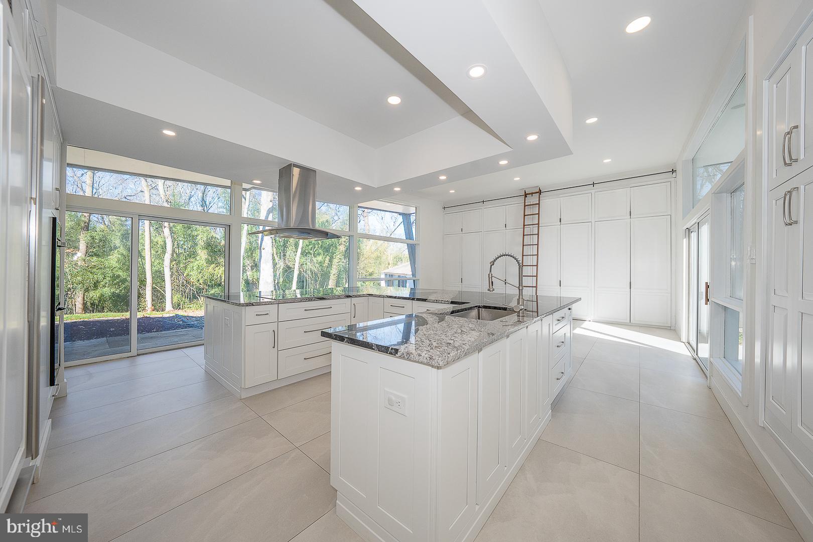 39-41 Fairview Road Penn Valley, PA 19072 - Photo 8 of 37 a kitchen with kitchen island granite countertop a sink and stove in it